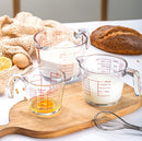 Glass measuring cup with handle and millimeter scale