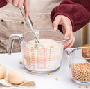 Glass measuring cup with handle and millimeter scale