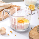 Glass measuring cup with handle and millimeter scale