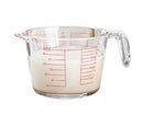 Glass measuring cup with handle and millimeter scale